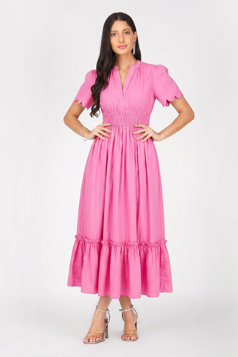 Woman wearing a pink dress on a white background