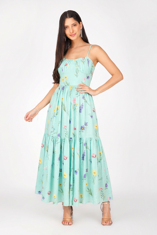 Woman wearing a light blue floral dress on a white background