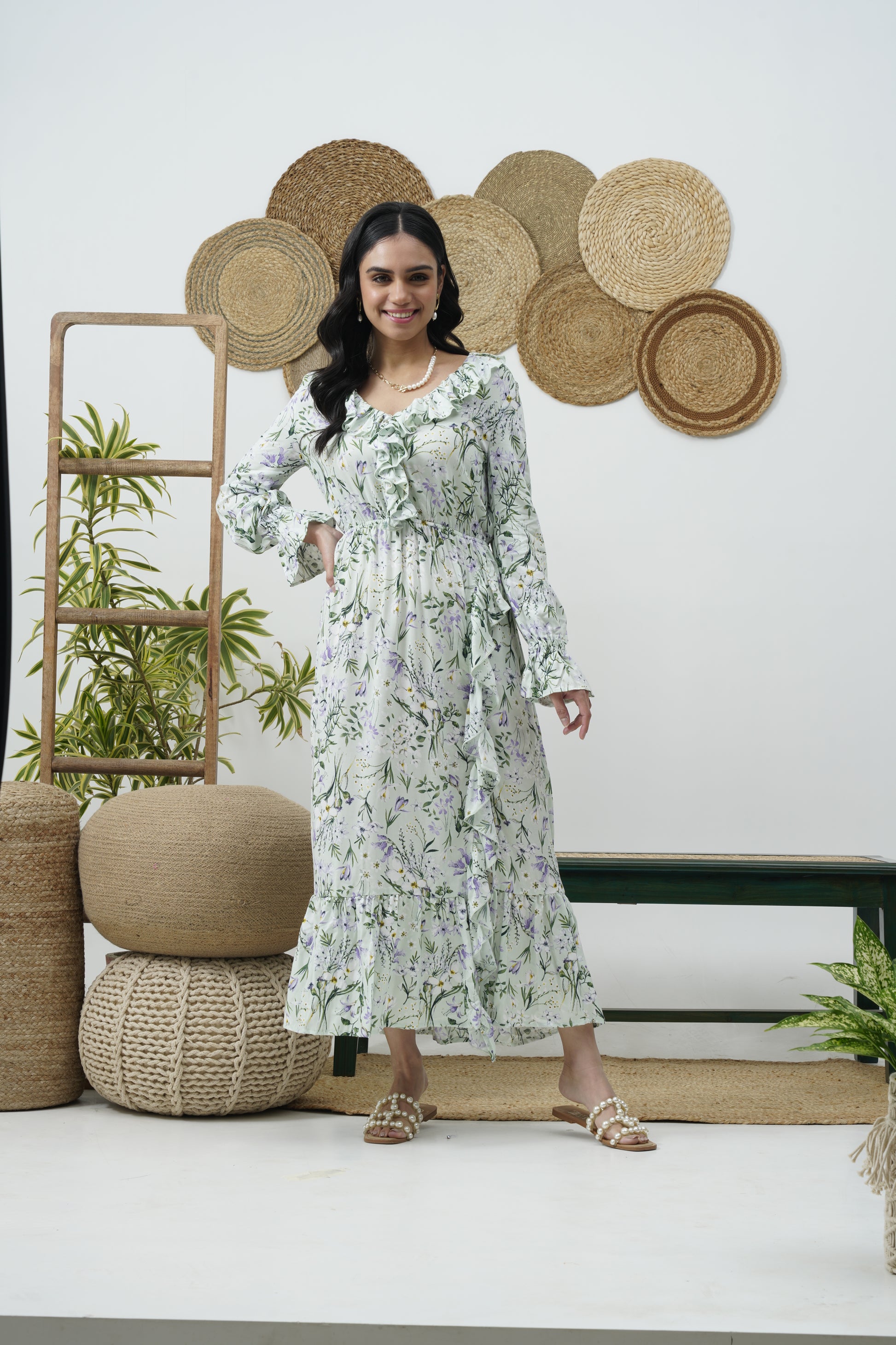 V-neckline with ruffles  long sleeves with elasticated cuffs  Sits relaxed on the body & fitted at the waist  Open back with Criss-cross detailing  Ruffled at the hem VACATIONS BEACH SUMMER DRESSES 