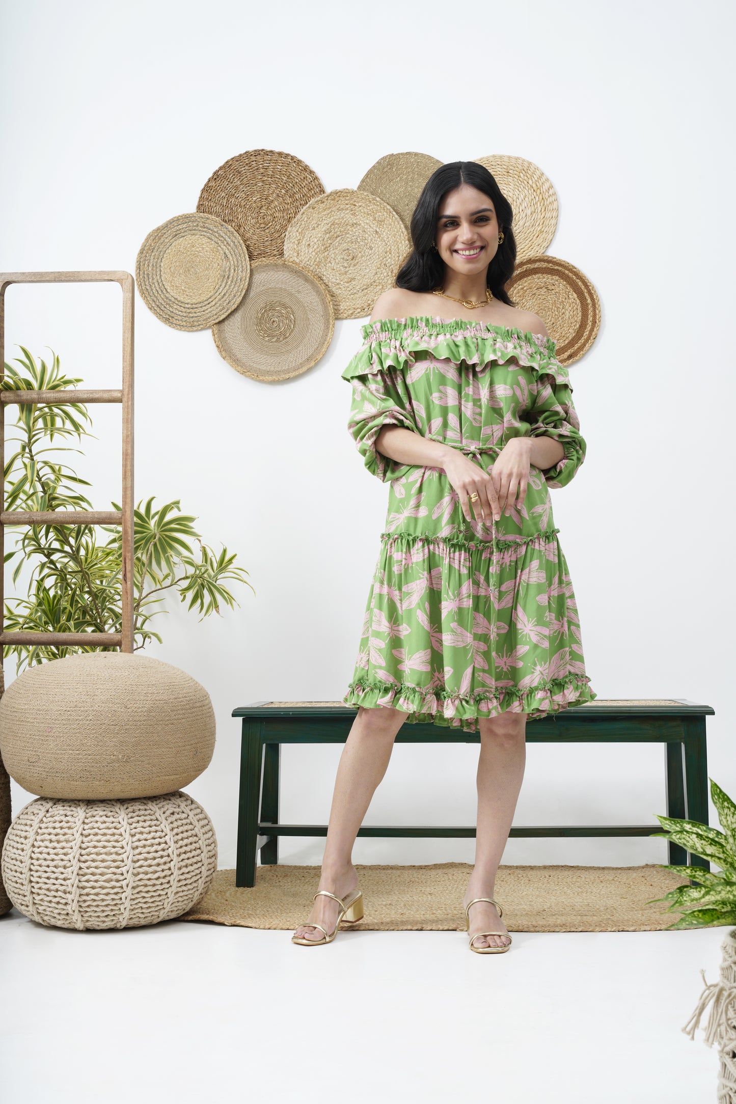 Features a gathered upper body  Styled off-shoulder  Medium length elasticated sleeves  Frilled hemline  Tie belt with dragonfly embellishments.  VACATIONS RESORT WEAR PARTY SUMMER DRESS