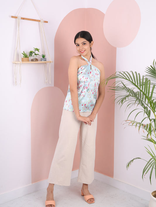 blue halter neck top elasticated at the back and detailed with a tie back